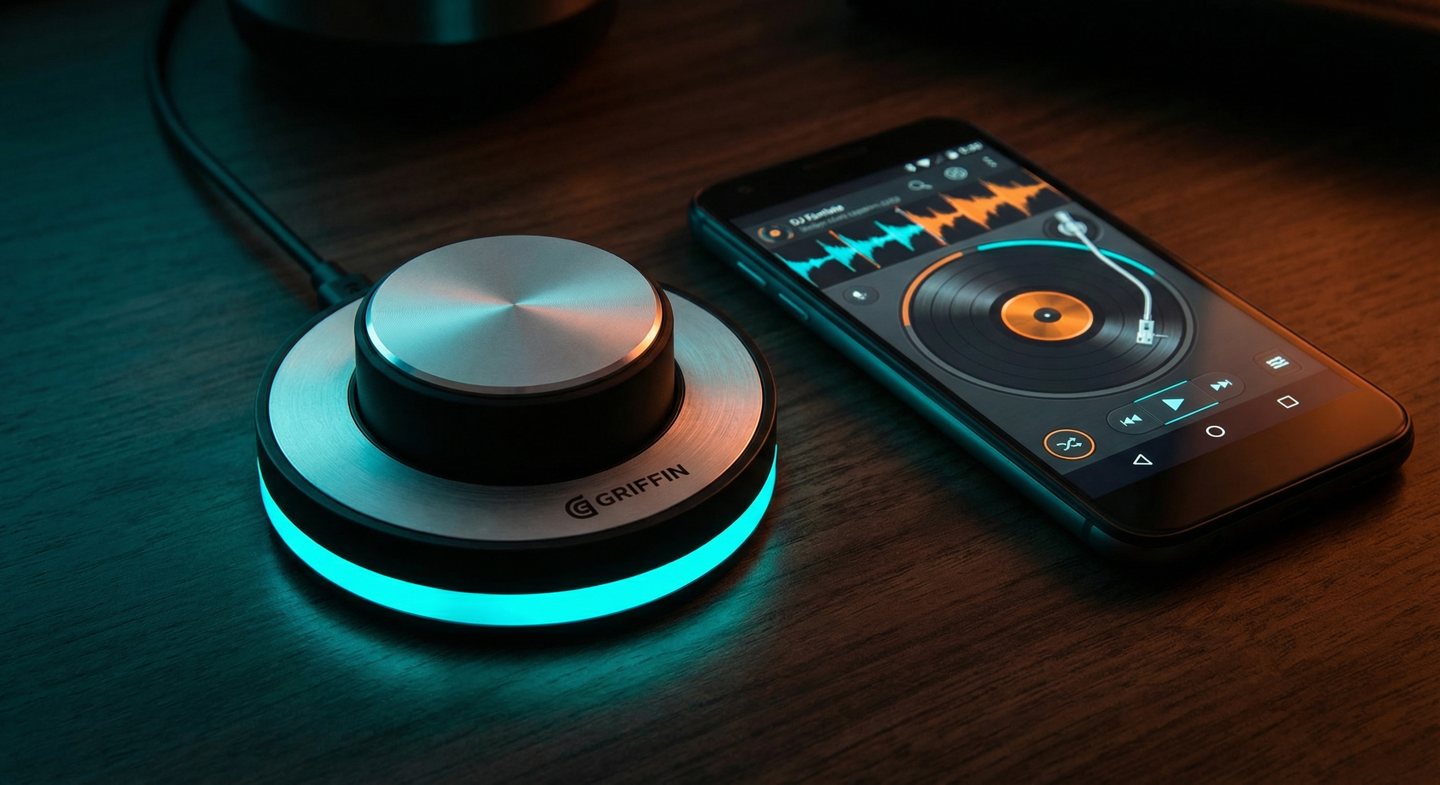 Griffin PowerMate USB controller with glowing cyan LED ring next to ScratchStream on an Android phone